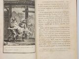 an open book with a picture of a man and a woman sitting on a bench