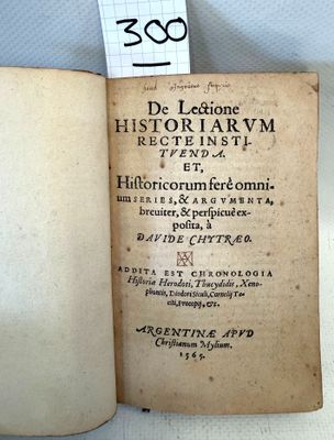 an old book that is open on a table