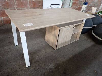 a wooden desk with a drawer underneath it in a room