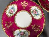 two plates that are decorated with flowers on them