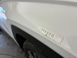 a sticker on the bumper of a white car