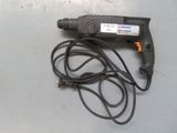 a cord that is connected to a drill on a table