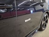 a picture of a car with a sticker on the door