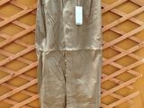 brown pants hanging on a wall with a yellow wall in the background