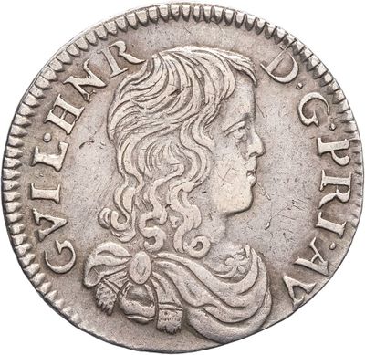 une pièce d'argent portant une tête de femme