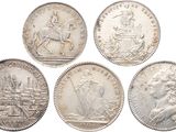 six different types of silver coins on a white background