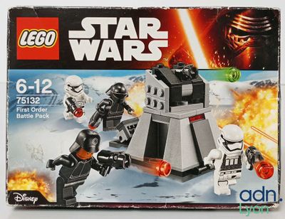 a box of lego star wars action figures with a battle scene in the background