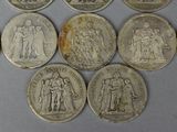 six different types of silver coins are shown on a white surface