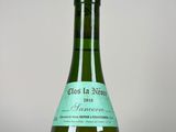 a bottle of wine that is sitting on a table