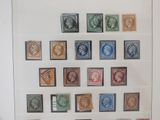 a picture of a collection of stamps on display in a glass case