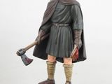 a figurine of a man with an axe in his hand