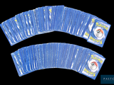 a lot of pokemon playing cards on a black background