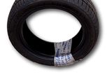 a close up of a tire on a white background with a piece of tape