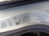 a close up of a car door with a sticker on it