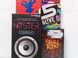 a box of games and a speaker sitting on a table