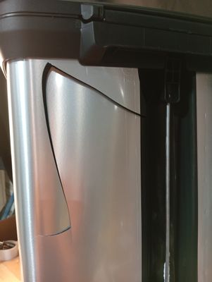 a close up of a stainless steel refrigerator on a counter