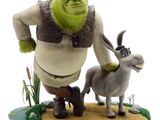 statue of a man and a donkey on a small island
