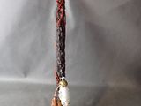 a small figurine of a person holding a knife