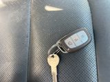 a car key sitting on the back seat of a car