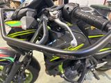 a close up of a motorcycle parked in a garage