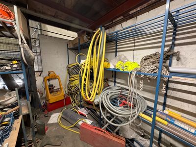a garage with a lot of tools and tools on the shelves