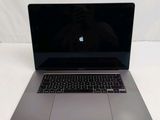 an apple macbook pro laptop computer sitting on a white surface