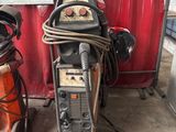 a welding machine that is sitting on the floor