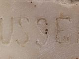 a close up of a stone with writing on it