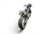 a motorcycle that is parked on a white surface