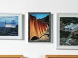 three pictures hanging on the wall above a bed