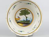 an image of a bowl with a deer and tree on it