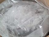 a cardboard box with a plastic bag on top of it