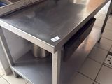 a stainless steel table in a commercial kitchen
