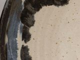 a close up of a plate with a cat on it