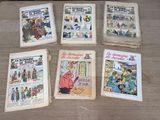 several books on a table with pictures of people on them