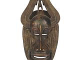 an image of a wooden mask on a white background