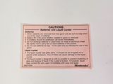 a picture of a caution sign on a refrigerator door