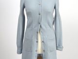 an image of a woman ' s coat on a mannequin