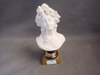 a white bust of a woman with flowers on her head
