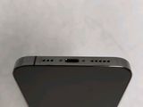 the back side of a black iphone with the camera facing towards the camera