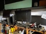 a desk with a monitor and a keyboard on it