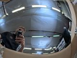 a man taking a picture of himself in a mirror