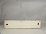 an image of a white metal plate with holes on it