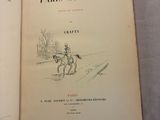 un livre ouvert sur lequel figure le dessin d'un homme à cheval