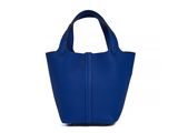 a blue handbag on a white background