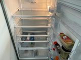 an open refrigerator with a lot of food inside of it