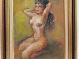 une peinture à l'huile représentant une femme nue, dans un cadre doré