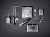a lot of silver items that are on a table