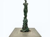 an image of a statue of a woman standing on a platform