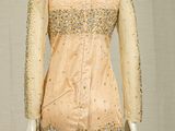 an image of a dress on a mannequin stand